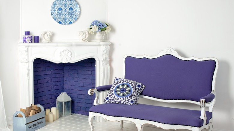 Bright blue sofa and fireplace