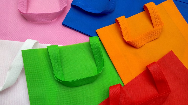 Flattened reusable shopping bags