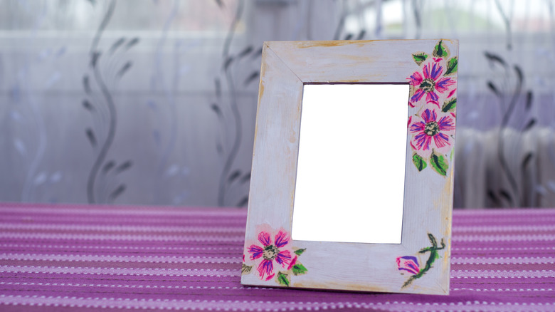 mirror frame with purple decoupage flowers