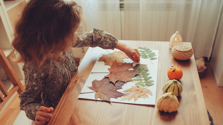 child with leaf art