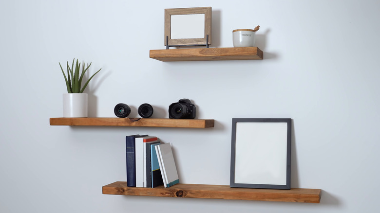 frames on floating shelves