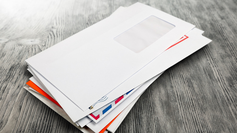 stack of mail on table