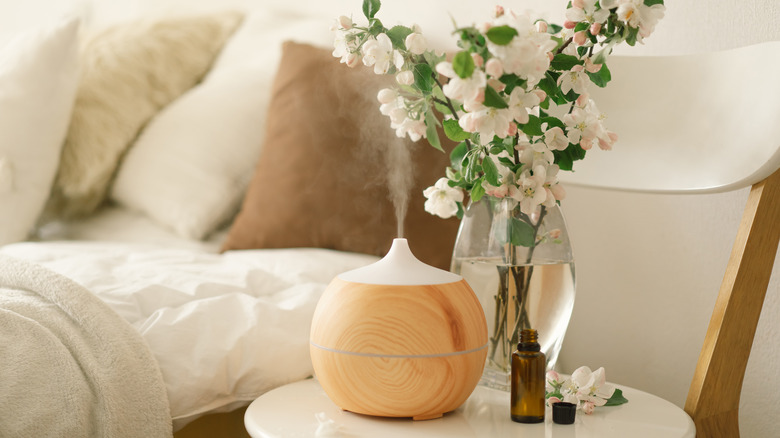 wooden diffuser on side table