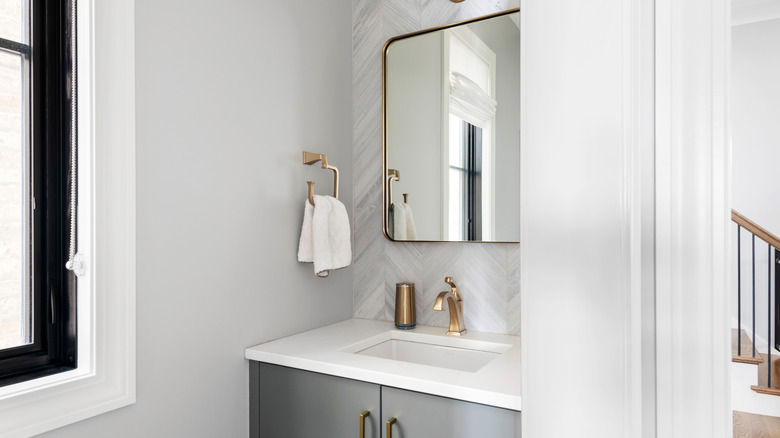 White and gray vanity in a half bathroom