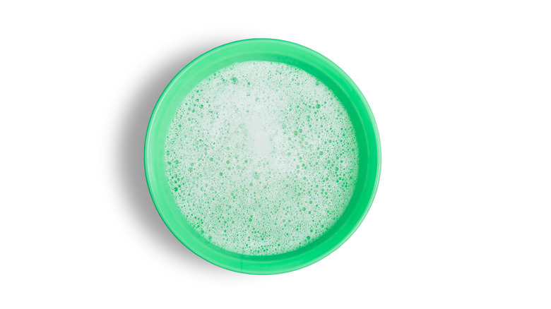 soap bubbles in green bowl