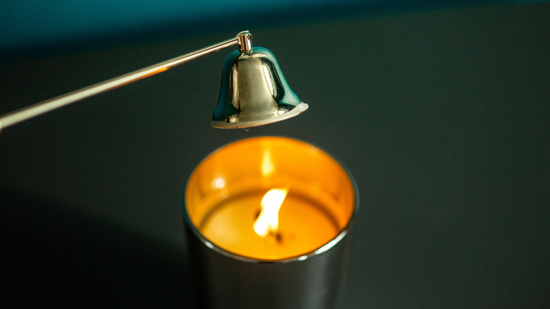 a snuff extinguishing a candle