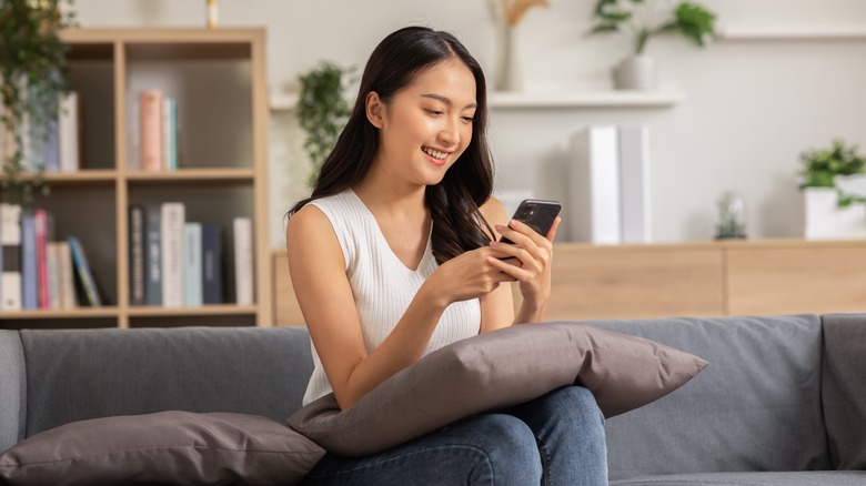 woman looking at phone