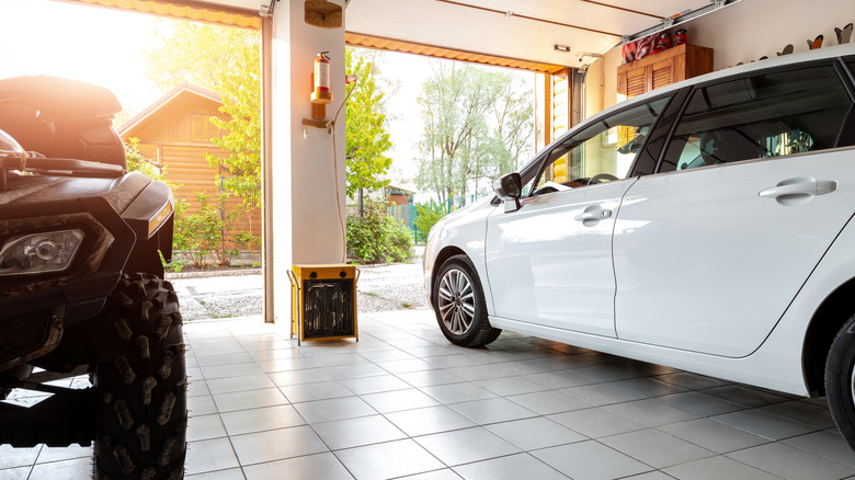 Garage with car and ATV