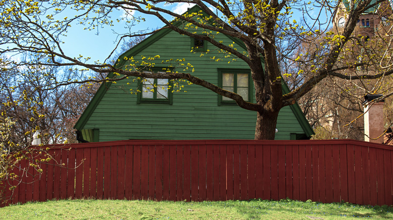 House with red picket fence