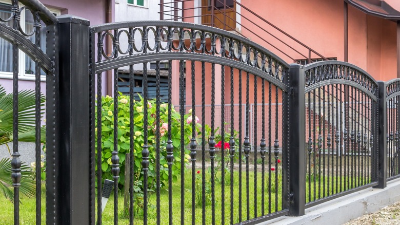 Metal fence bordering garden