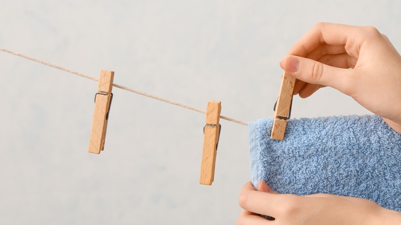 Clothespins pinning towel