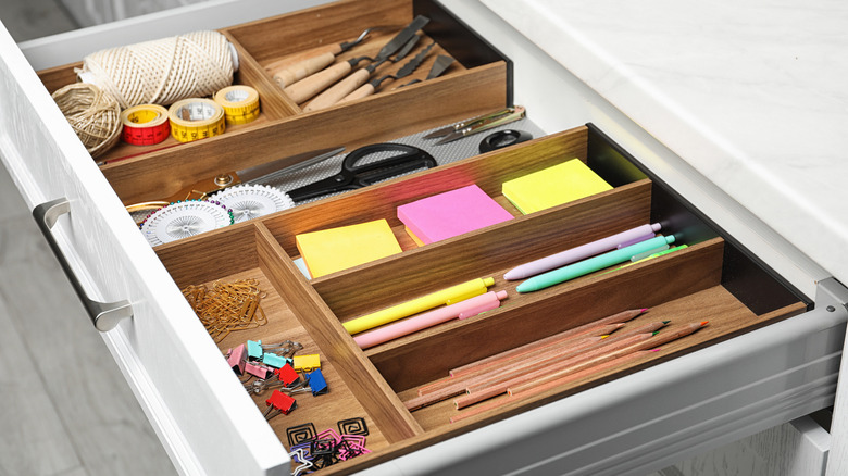 insert drawer with various supplies