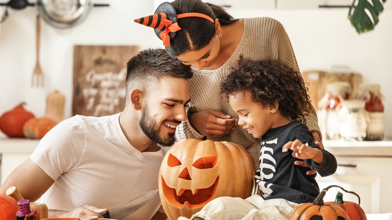 Family with carved pumkin