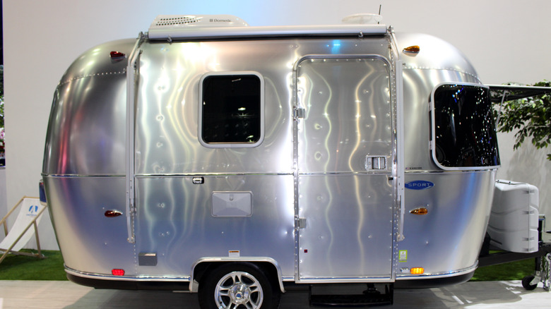 shiny and small Airstream trailer