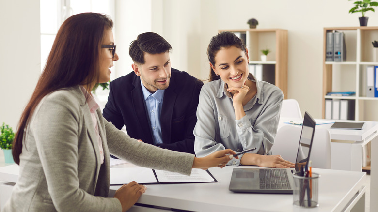 People meeting real estate agent