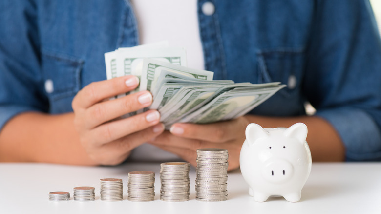 woman holding money in hands