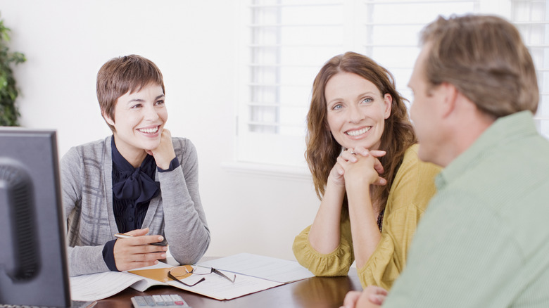 couple with professional  in office