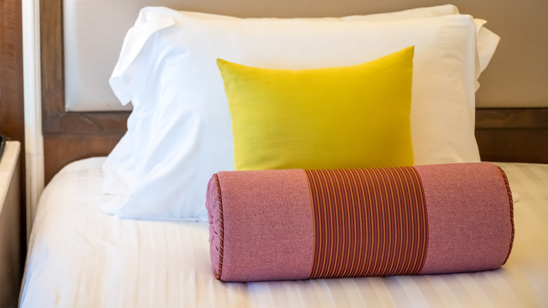 Bolster and pillows on bed