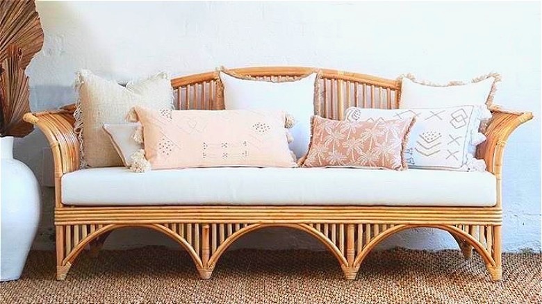 Bench with pale throw pillows