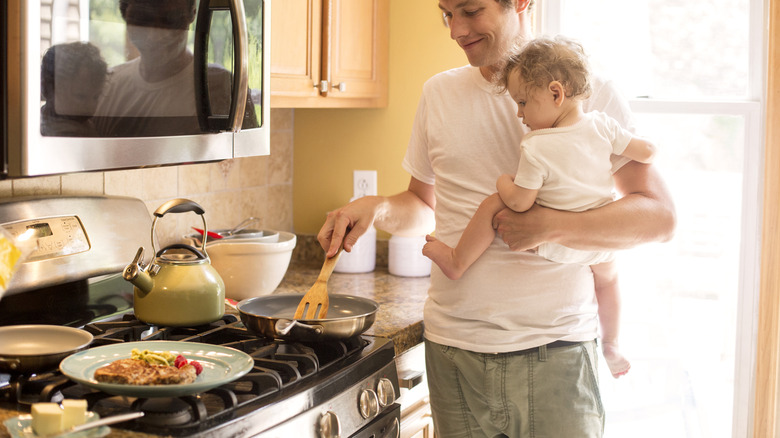 Person cooking on gas stove