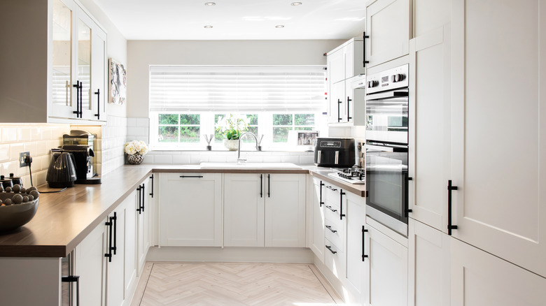 Modern updated kitchen with white cabinets