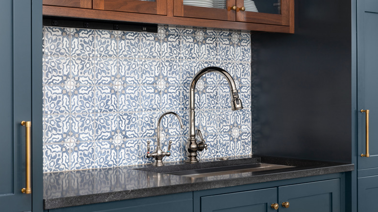 Pantry with patterned tile backsplash 