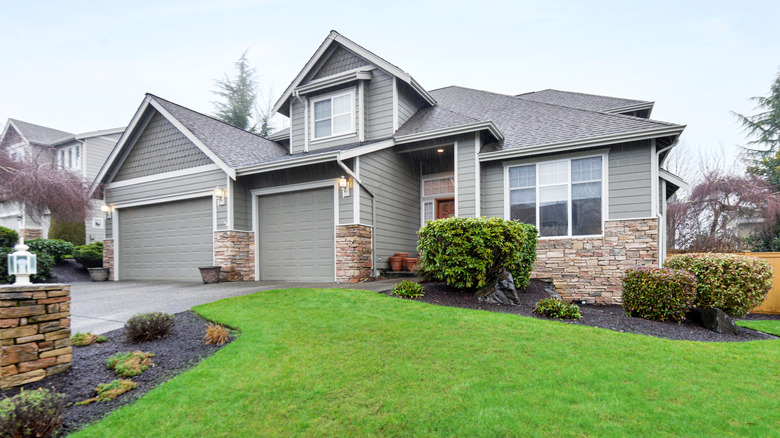 A home's beautiful sloping lawn