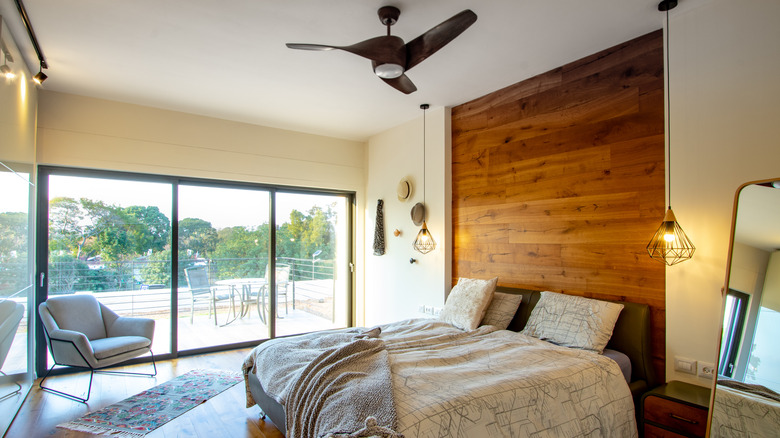 Bedroom with uncovered glass doors