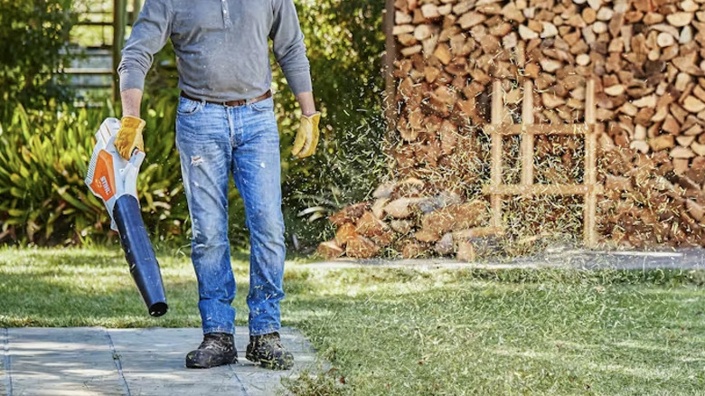 Man using blower by Stihl