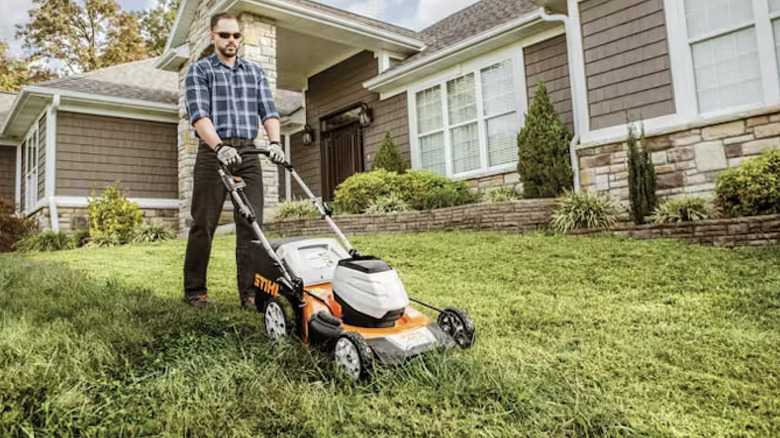 Stihl lawn mower being used by a man