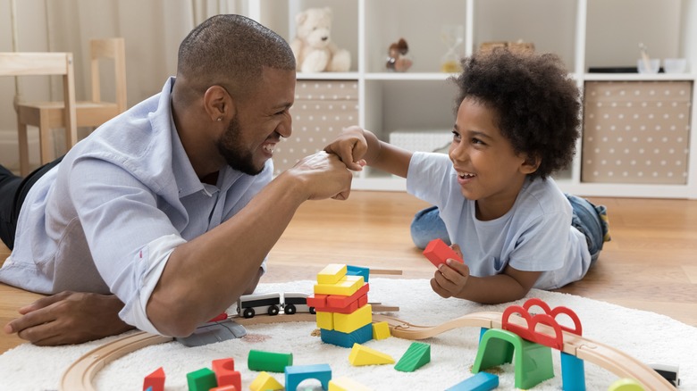 happy father and son playing