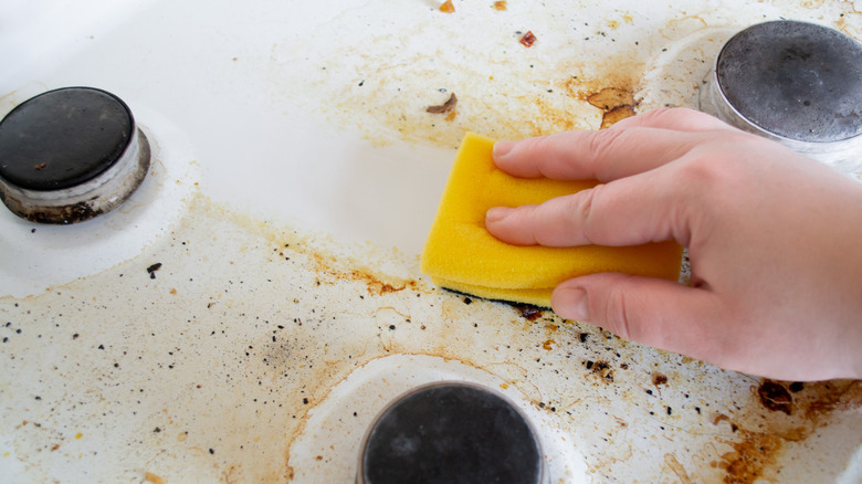 Sponge washing dirty stove