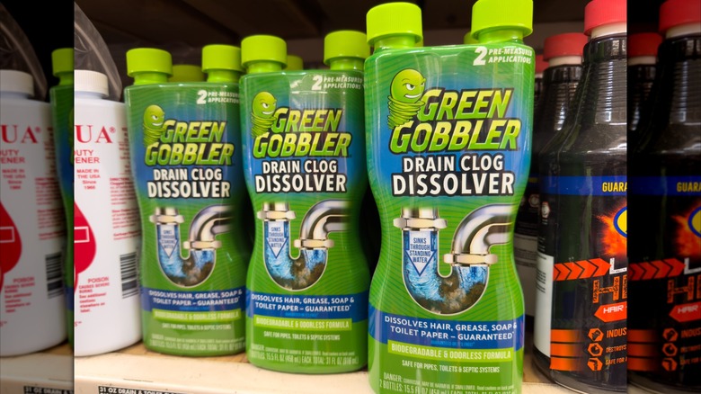 Three bottles of Green Gobbler enzymatic drain clog cdissolver