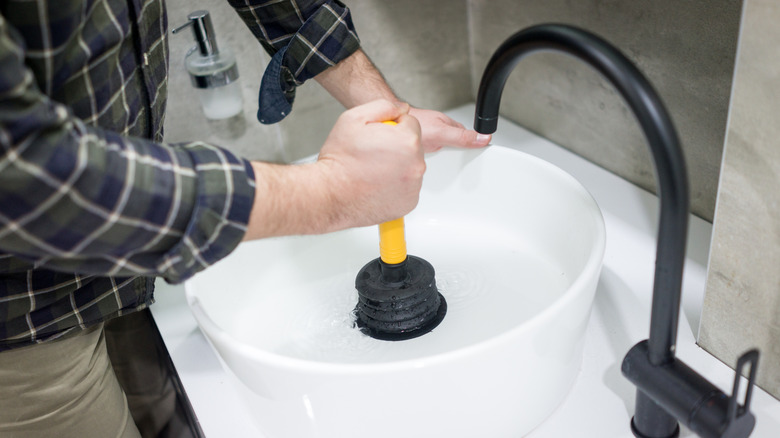 Using a plunger on a sink drain