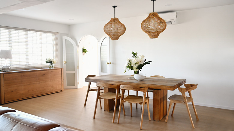 A dining room with blank white walls