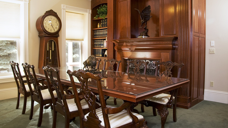 A dining room with antique wood furniture