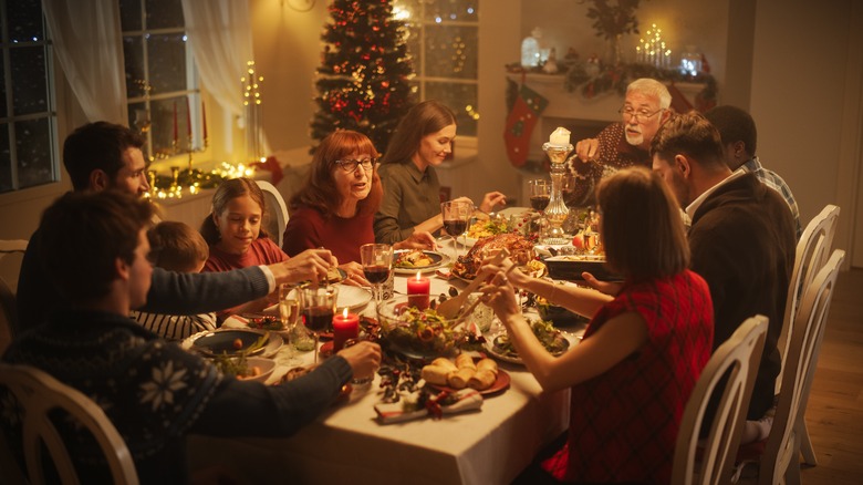 A family gathering for a holiday meal in the dining room