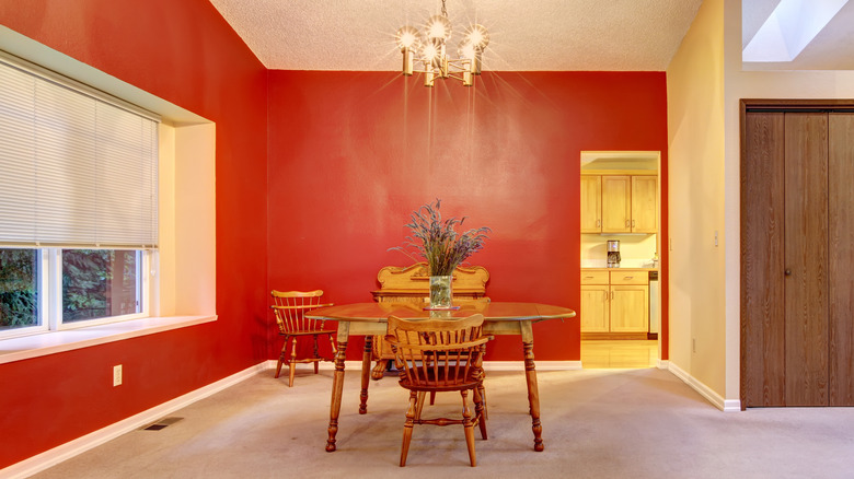 An outdated red dining room