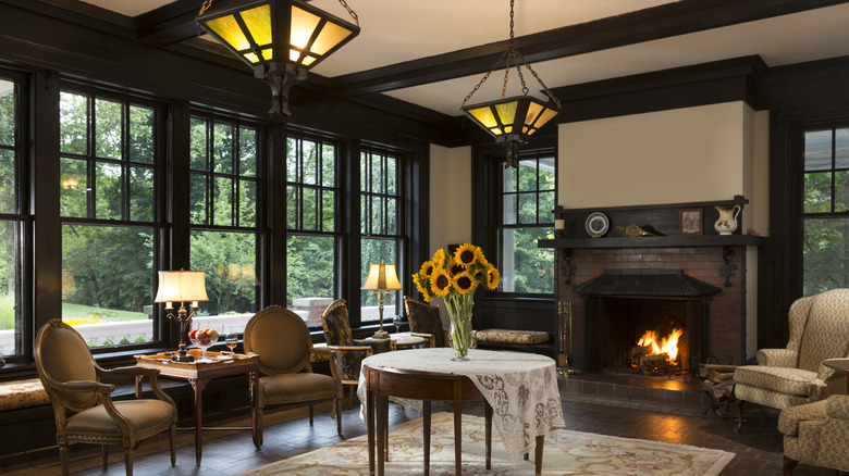 Formal living room with Victorian pieces and a fireplace