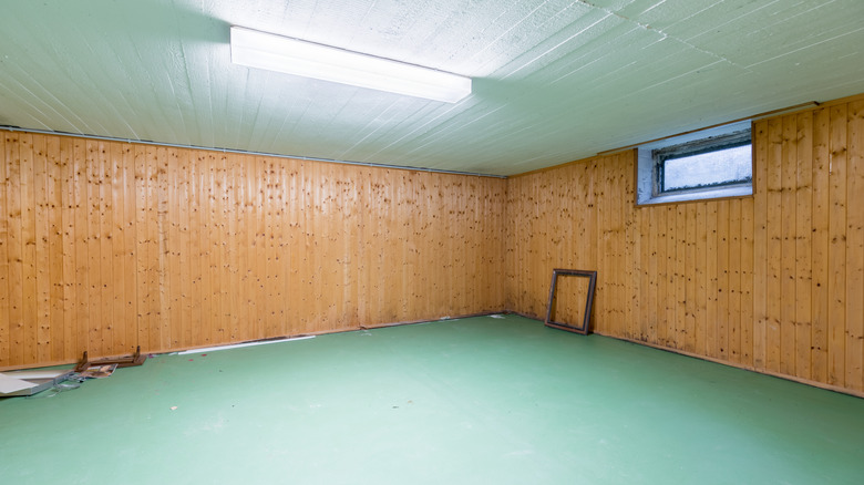 Old basement with wood panels on the walls