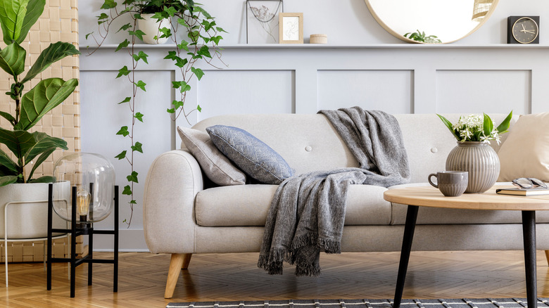 Beige couch with gray wall