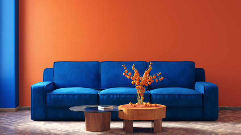 Blue couch with terracotta decor