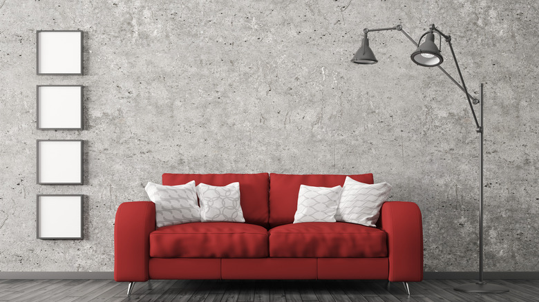 Gray wall with red couch