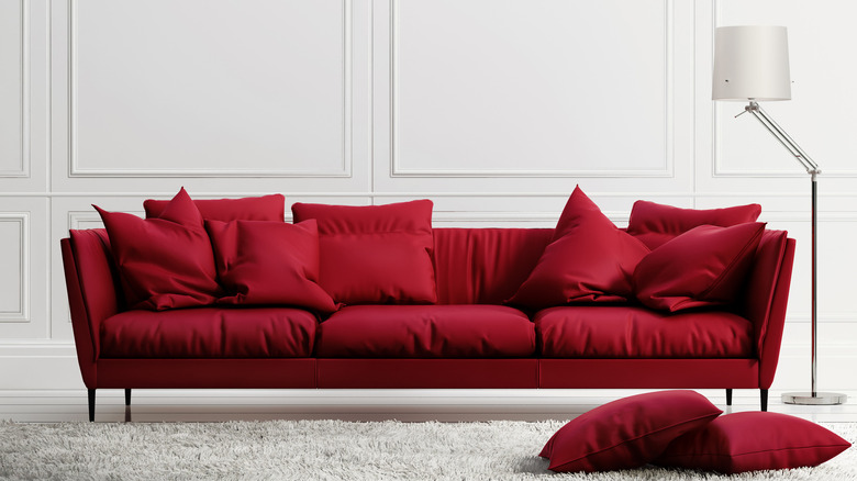 White walls with red couch