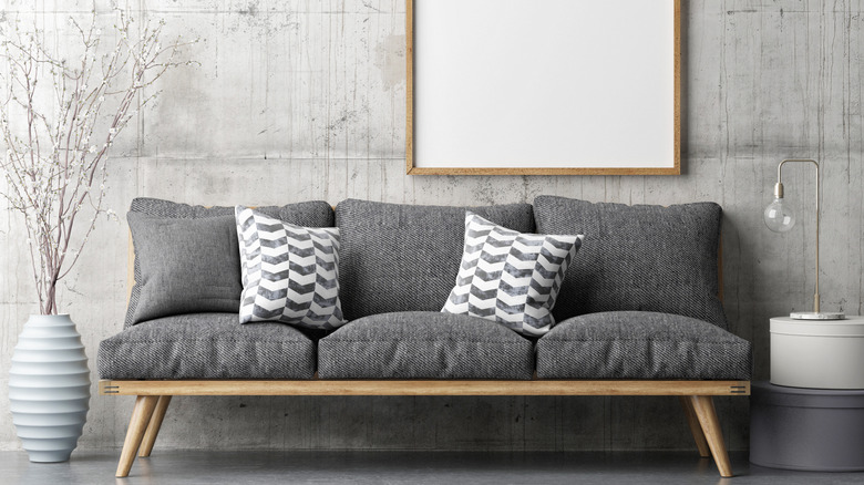 Grey couch with gray wall