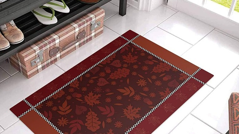 Burgundy rug with leaves