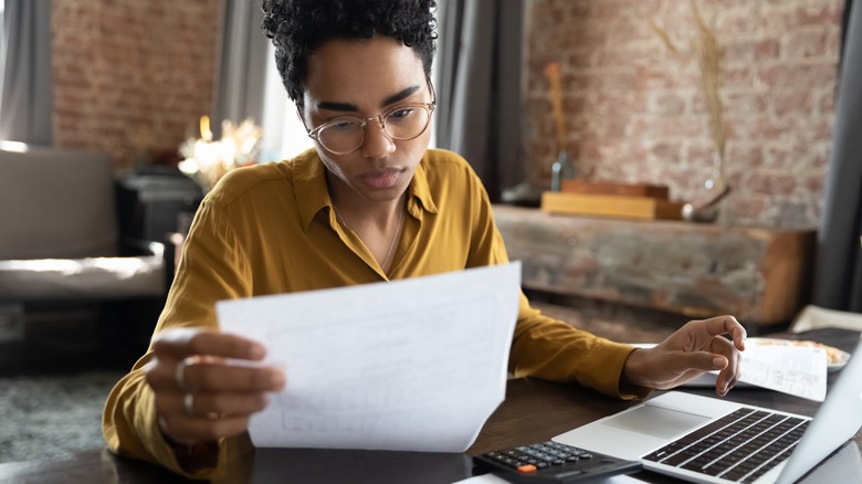 woman examining heloc contract