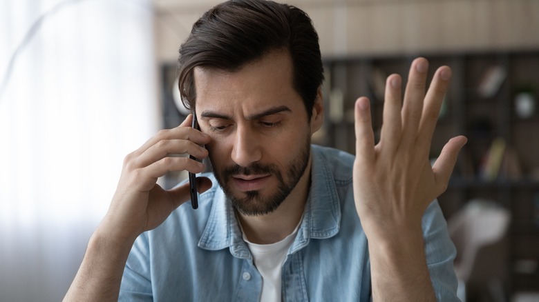 man upset on phone