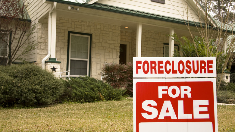 home with foreclosure sign