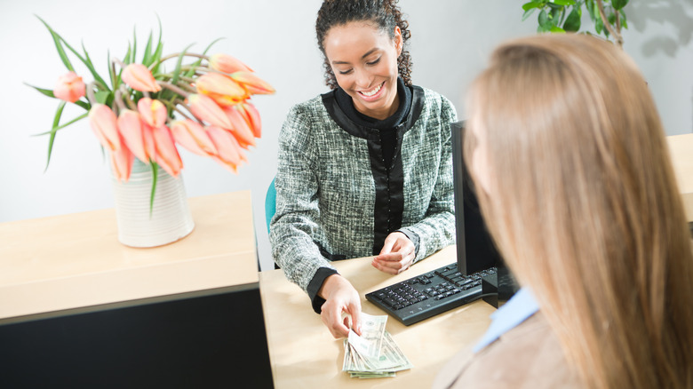 woman drawing cash from heloc